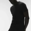 La camiseta de cuello redondo Triumph | Camisetas de tirantes y camisetas de yoga para hombre