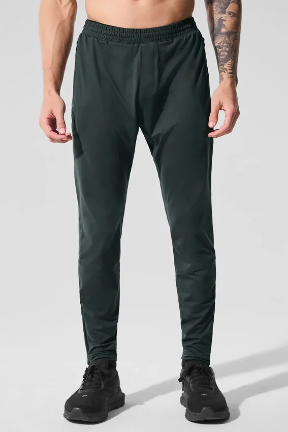 Pantalones deportivos Conquer React — Verde carbón