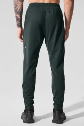 Pantalones deportivos Conquer React — Verde carbón