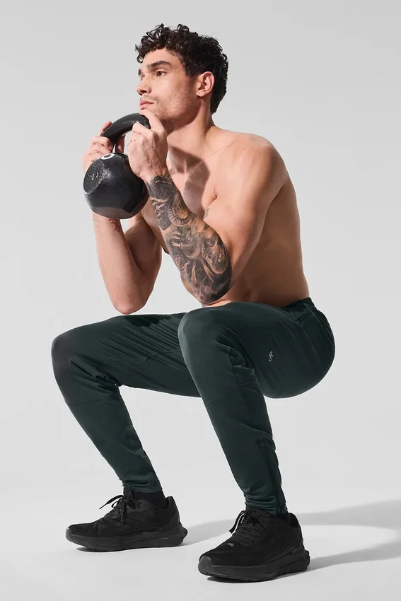 Pantalones deportivos Conquer React — Verde carbón